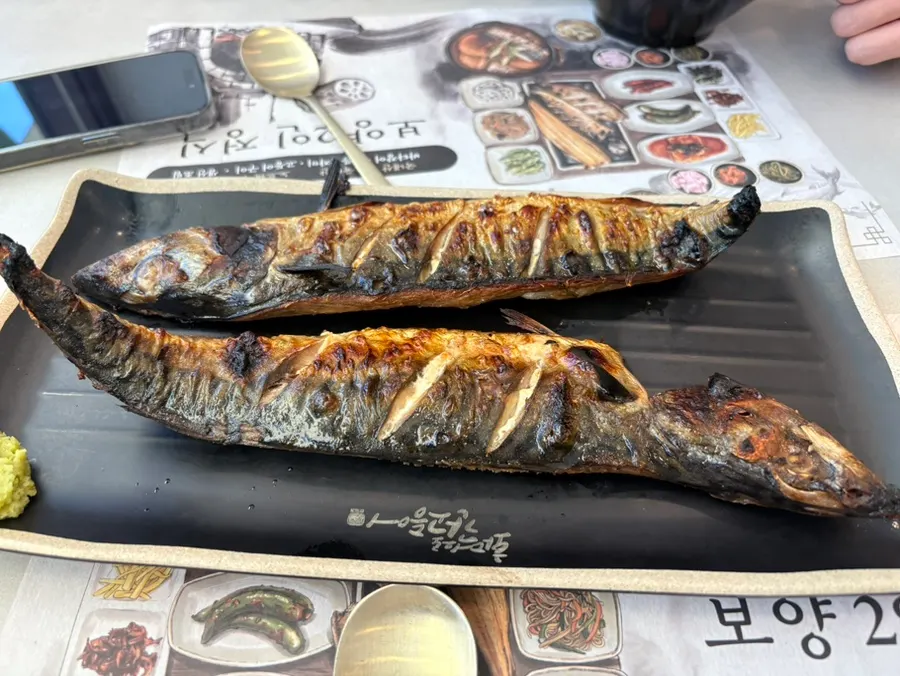 A full meal with large, golden-brown oven-grilled mackerel
