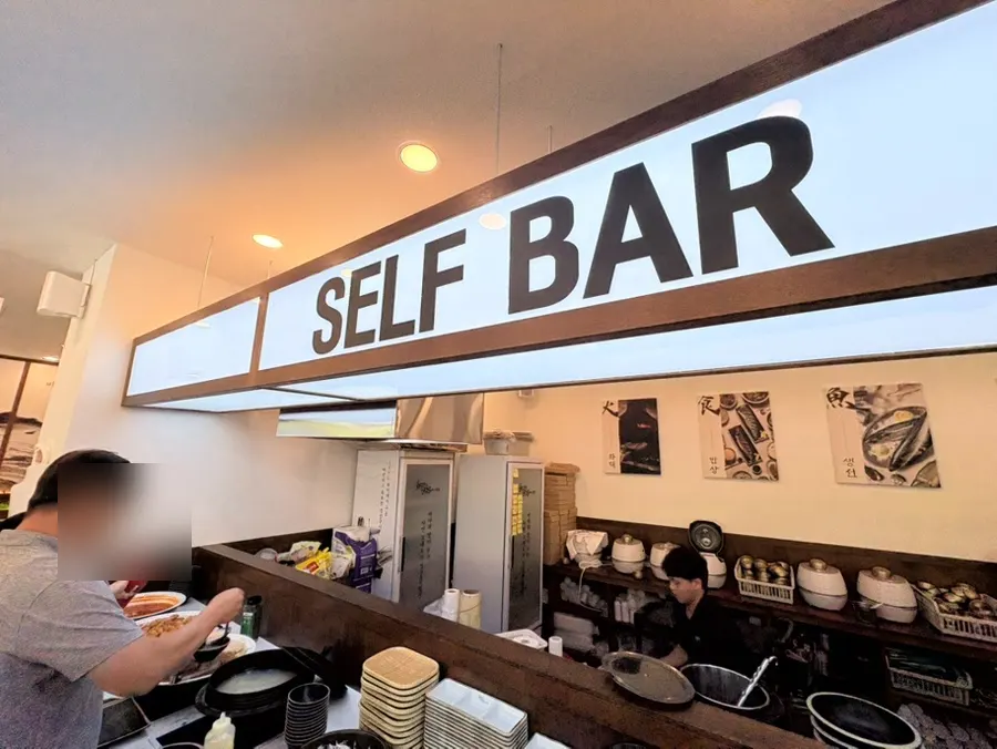 Self-serve counter where diners can freely take side dishes