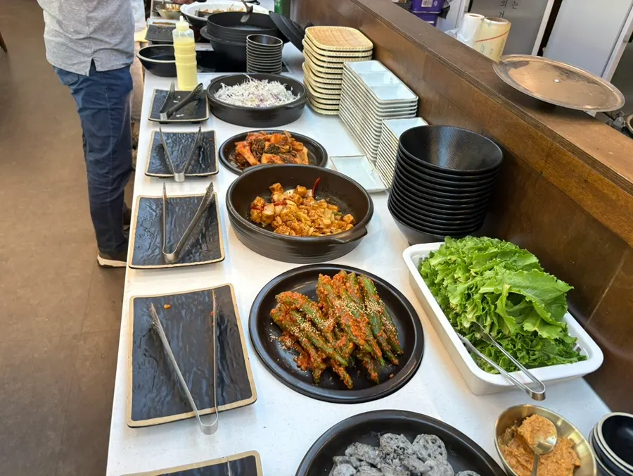 Various namul side dishes at the self-serve counter