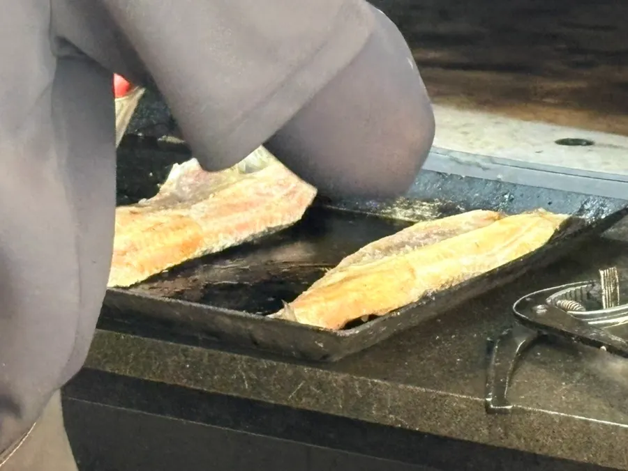 Warm grilled fish enjoyed comfortably at a restaurant