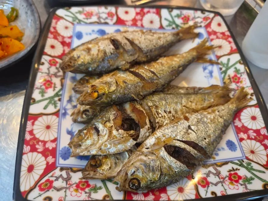 Seasoned gizzard shad tossed with cucumber and carrot