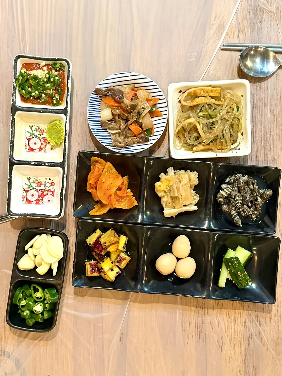 An assortment of raw fish restaurant side dish plates