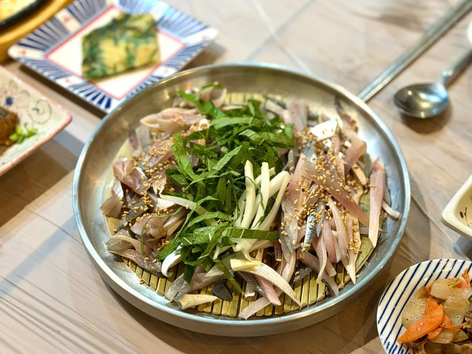 A plate of seasonal autumn gizzard shad sashimi