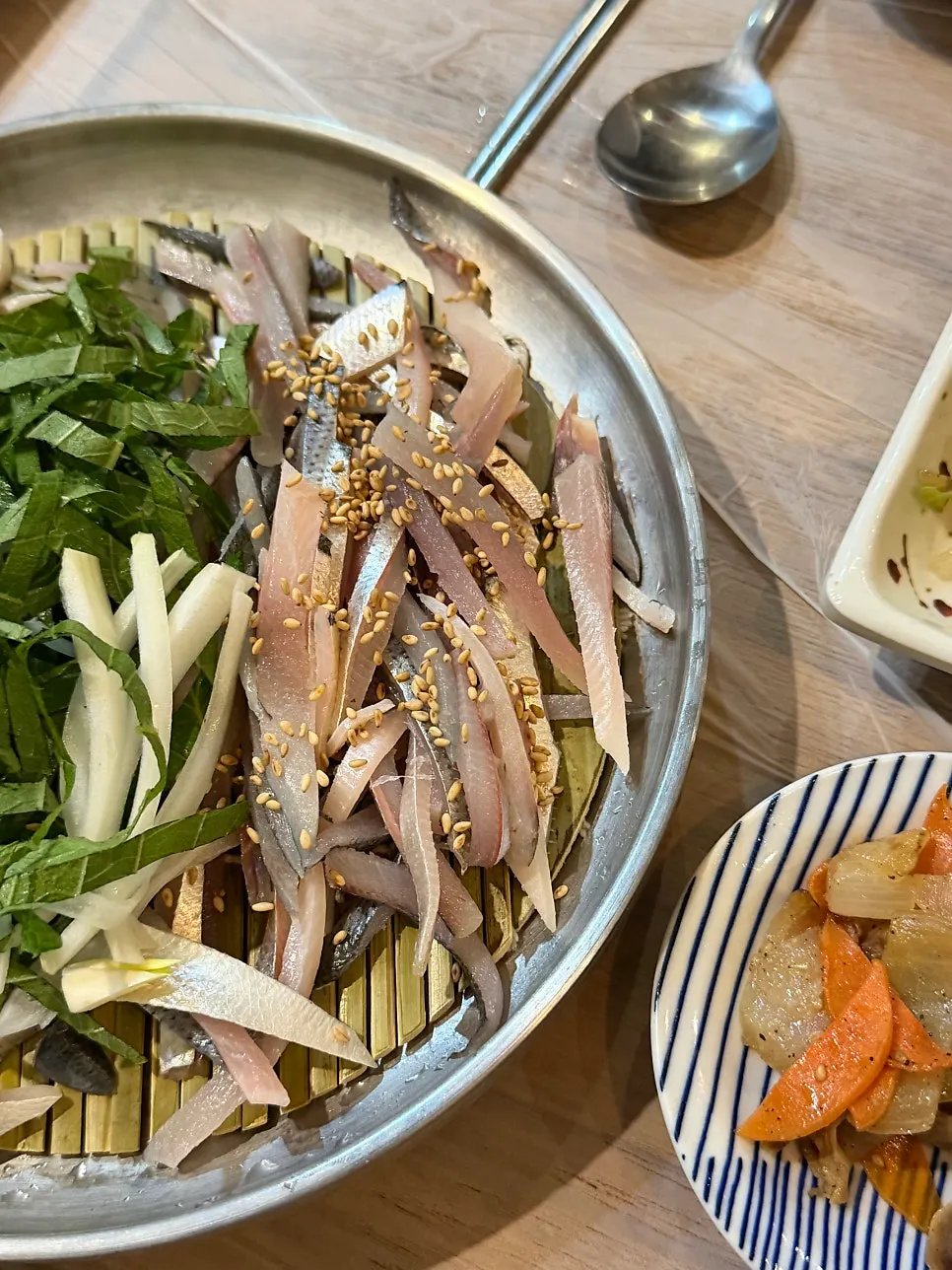 A plate of deboned gizzard shad sashimi