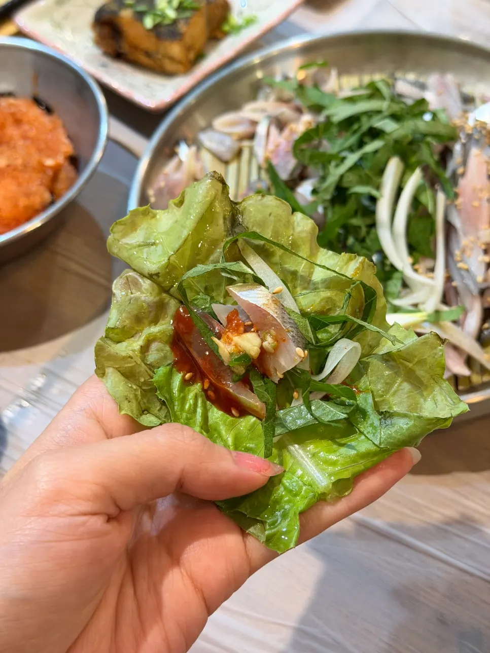 Autumn gizzard shad sashimi eaten wrapped in lettuce
