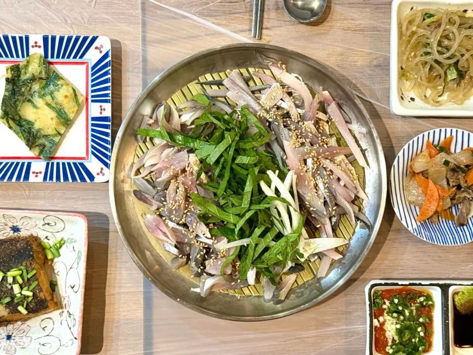 Full table spread of the half-and-half gizzard shad sashimi