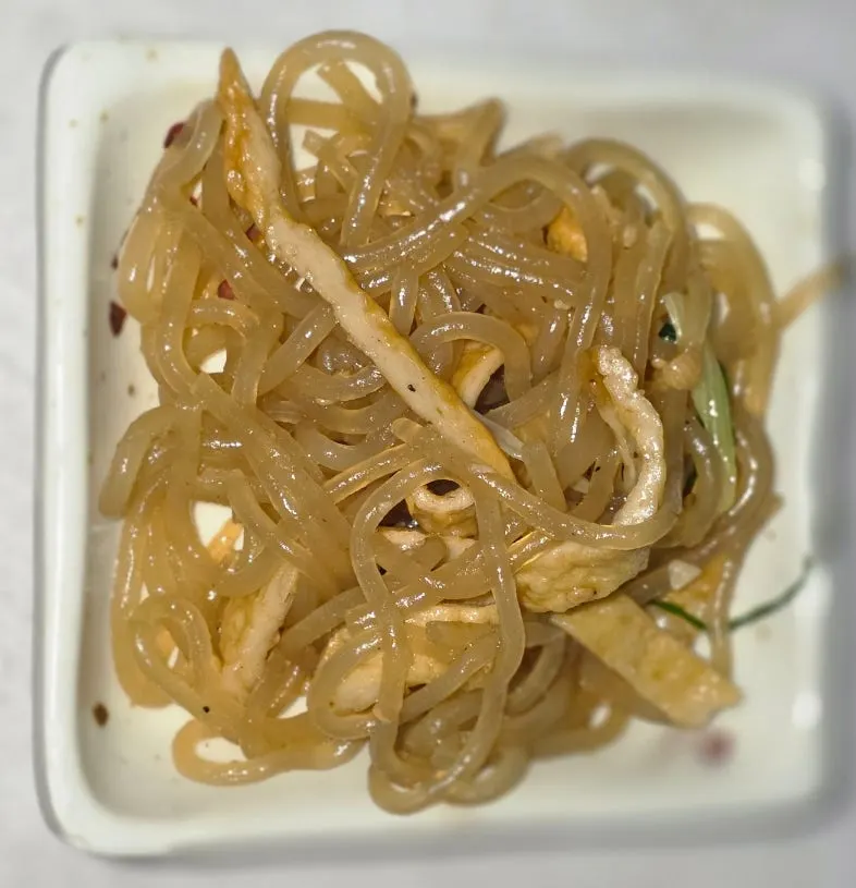 Side dish spread including glass noodles and sweet potato