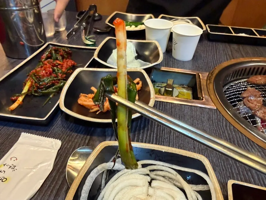 A piece of hanwoo topped with salt and wasabi