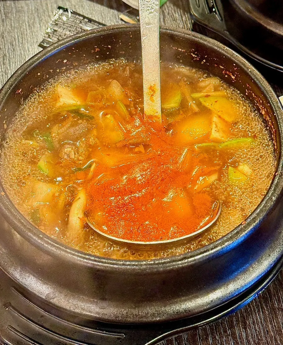 Beef doenjang stew and a bowl of rice ordered as a side