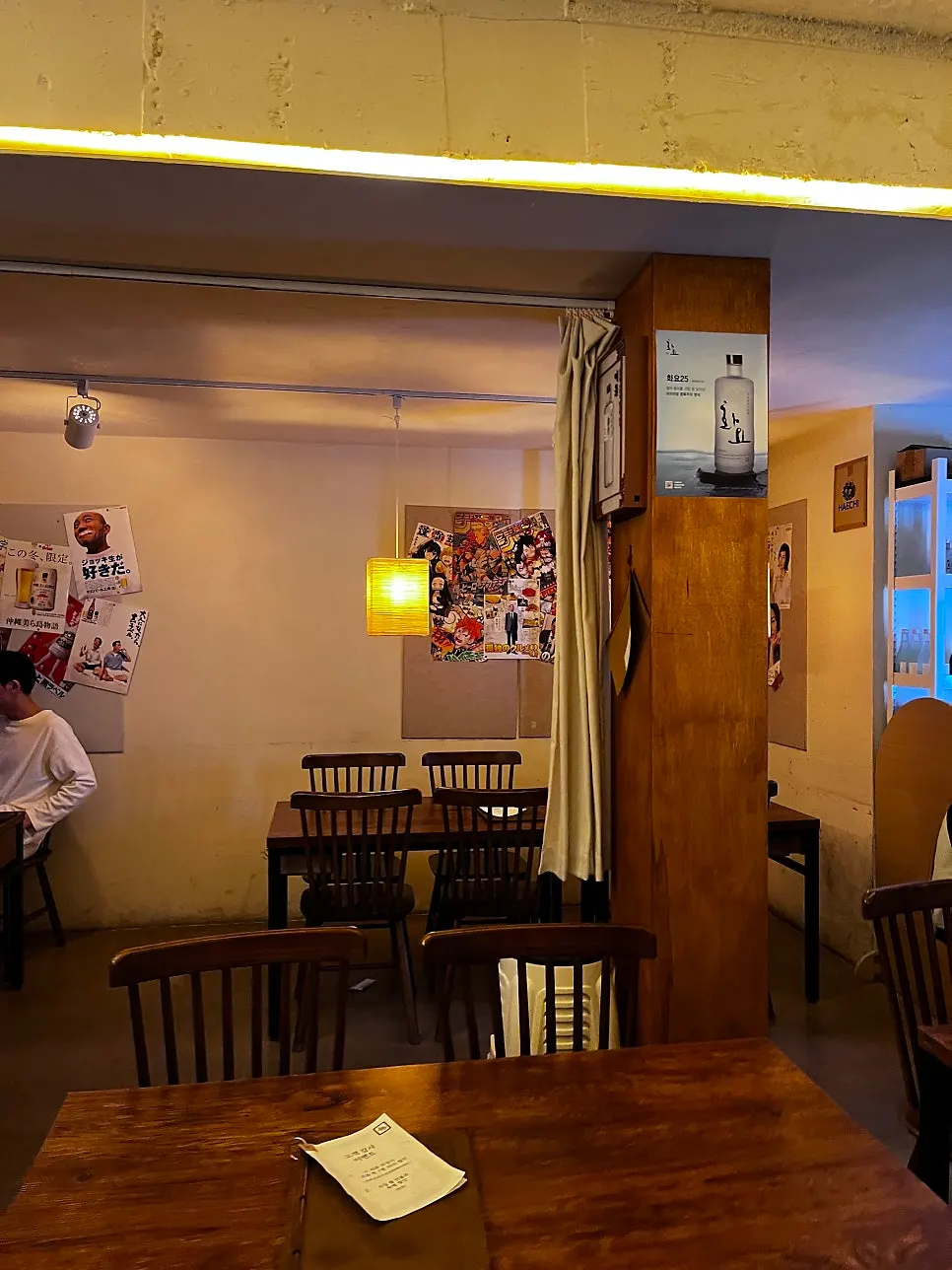 A corner of the store with a coat hanger and small items