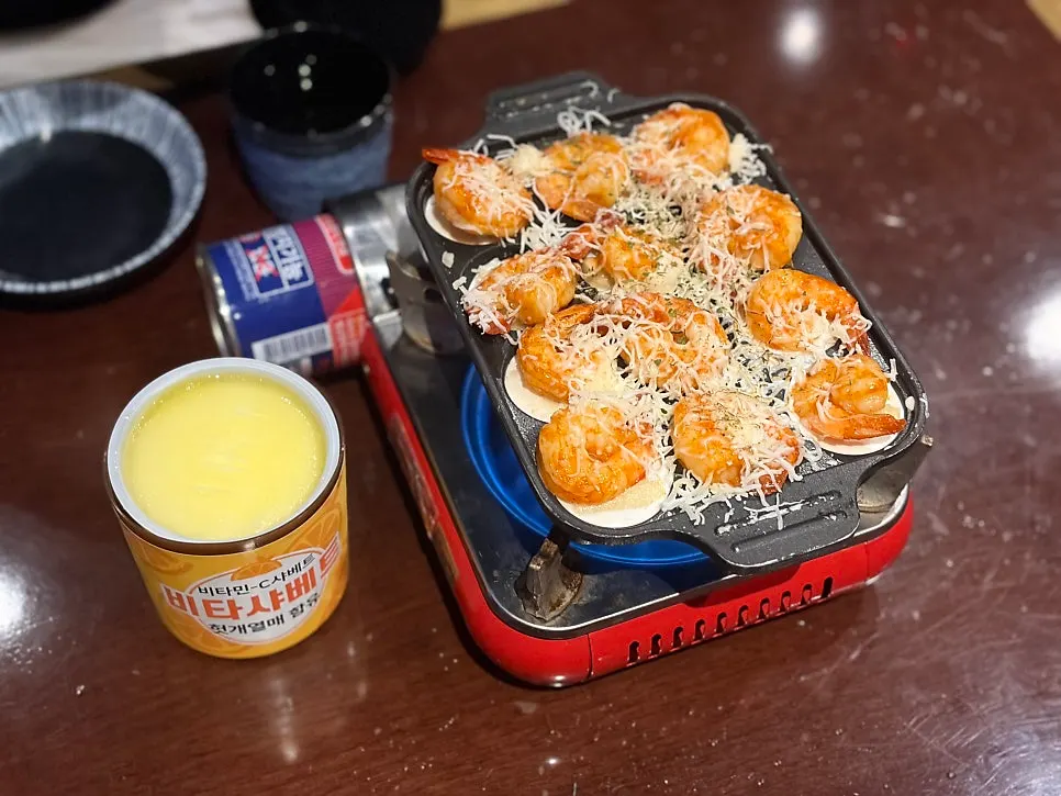Shrimp cheese fondue served on a takoyaki pan