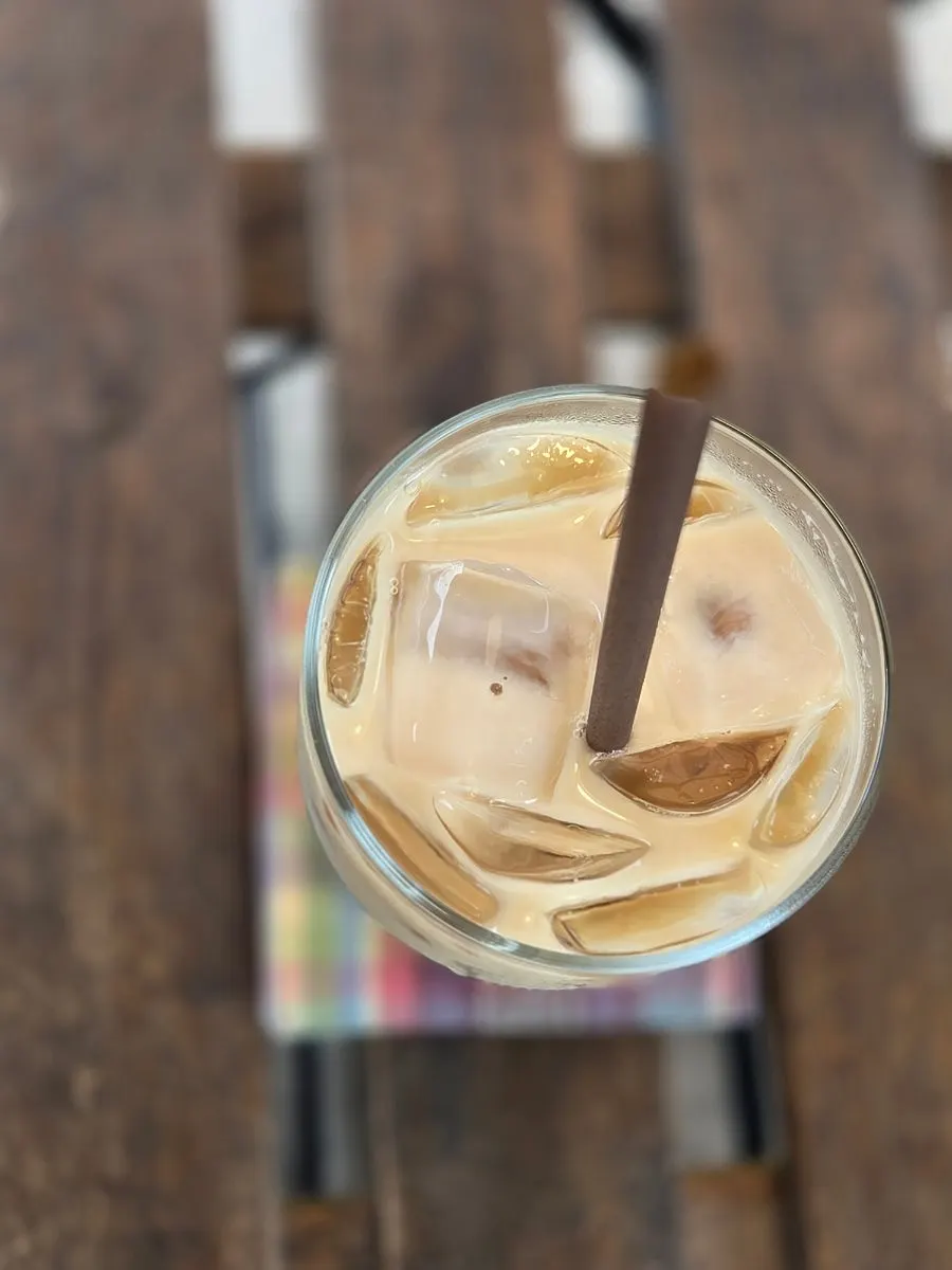 A cup of Sisup's handmade vanilla bean latte