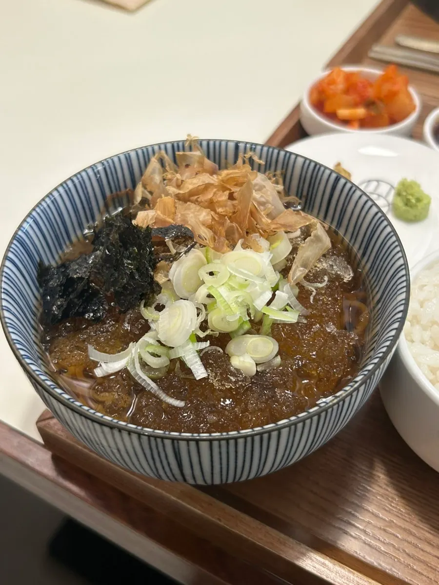 Mini cold soba topped with bonito flakes and seaweed flakes