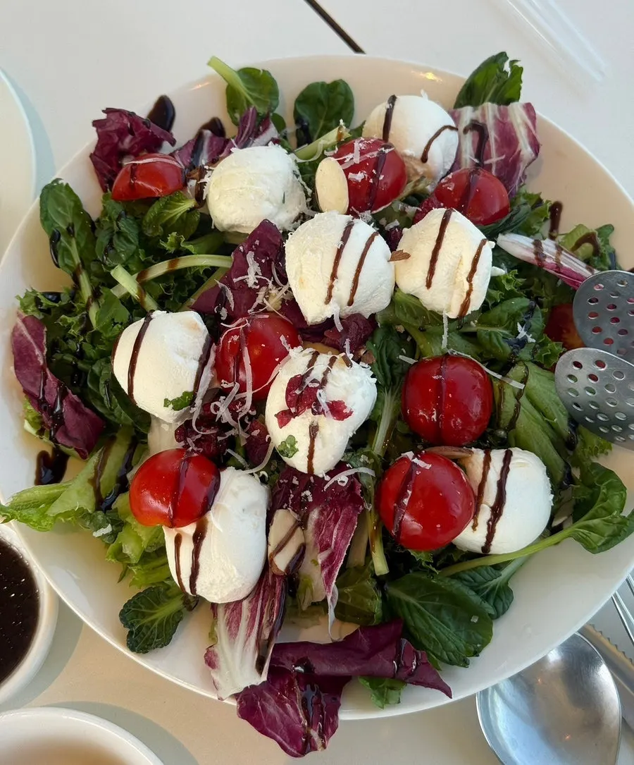 Ricotta salad topped with ricotta cheese and cherry tomatoes