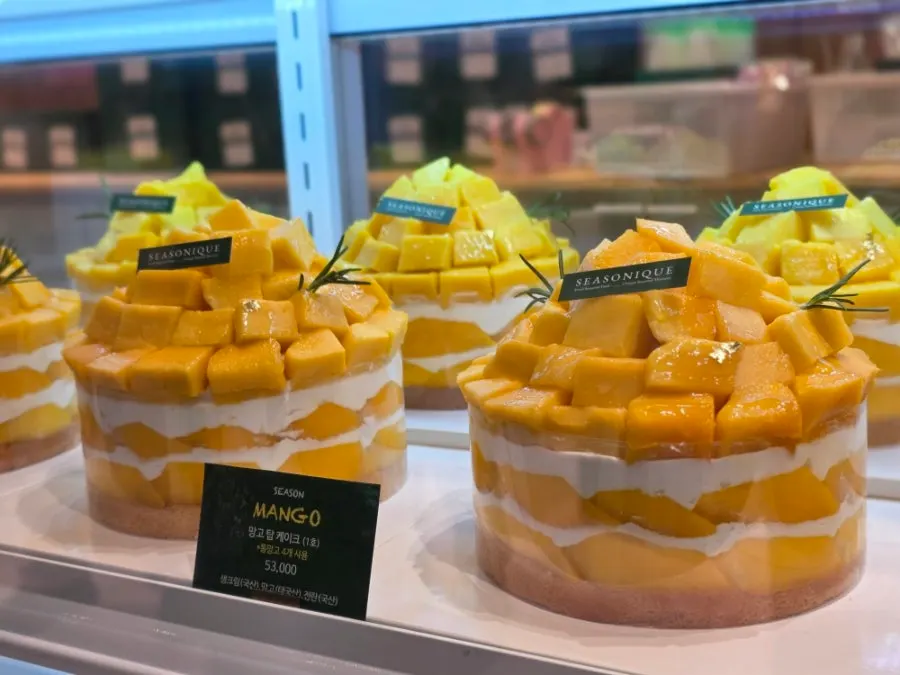 Display shelf with mango cake price tags
