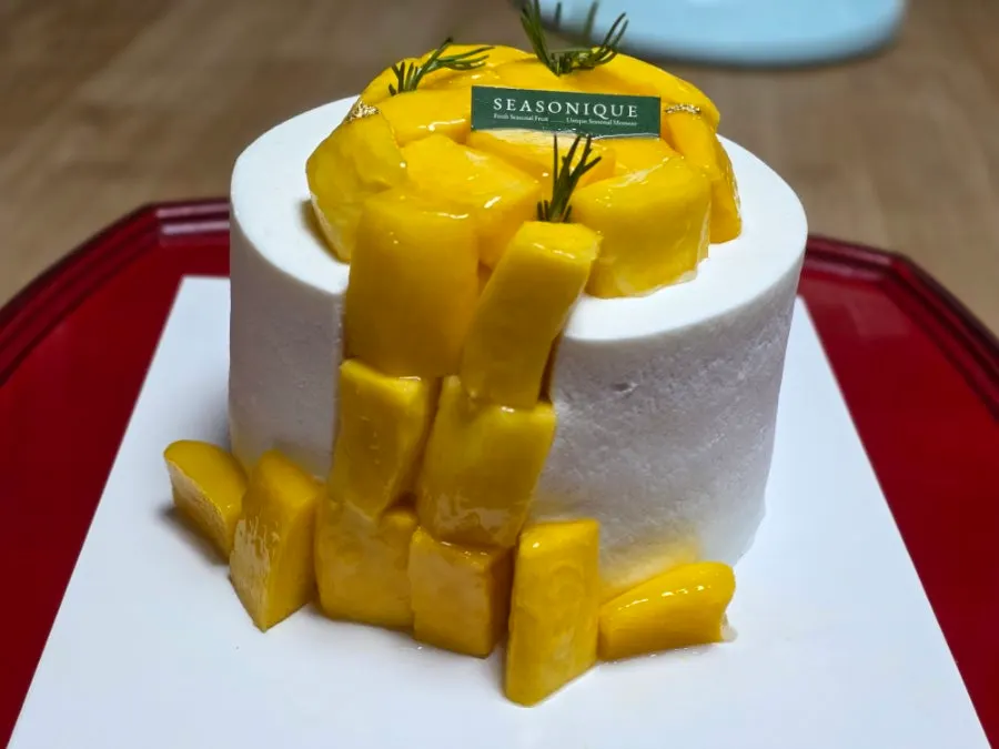 Cross-section of the cake showing layers of mango flesh