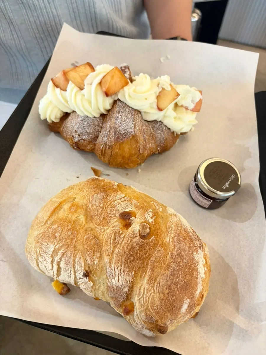 Tray with ordered bread and americano