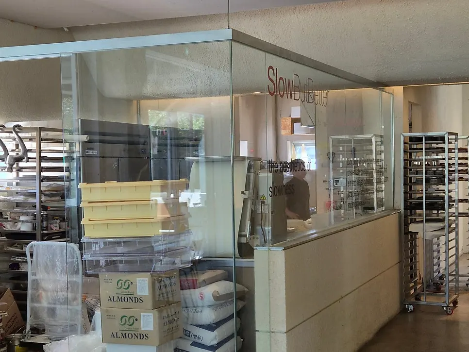 The bakery case not yet fully stocked right after opening