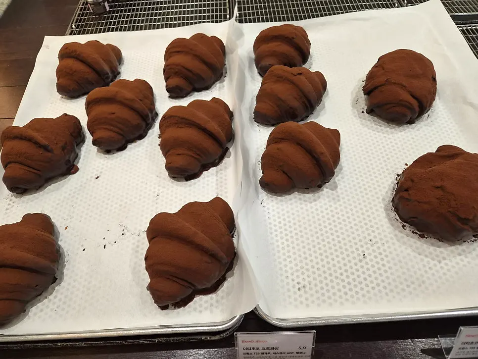 A row of various breads at Slow But Barrel