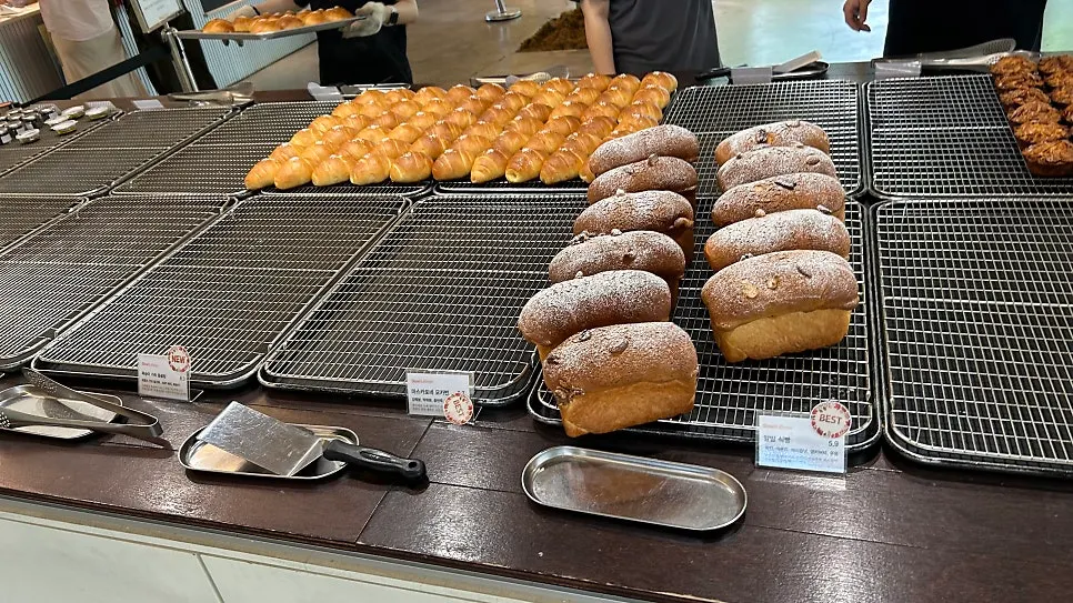 Bakery shelves being restocked right after opening
