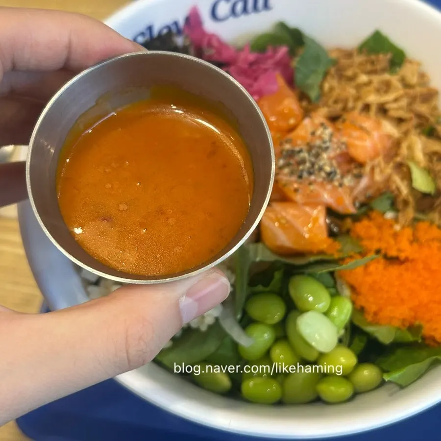 Salmon poke topped with spicy sauce