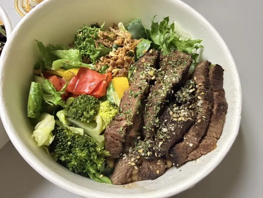 Two Slow Cali poke bowls packed for takeout