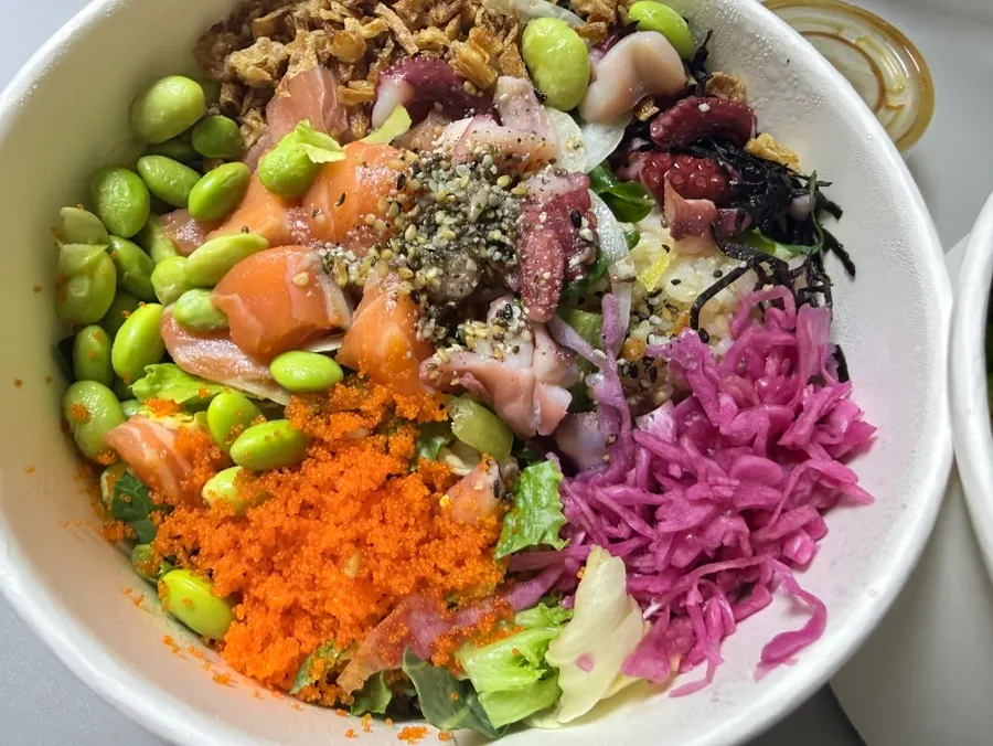 All-in-one poke topped with salmon, tuna, and octopus