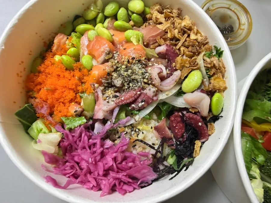 Poke bowl with edamame, red cabbage, and flying fish roe