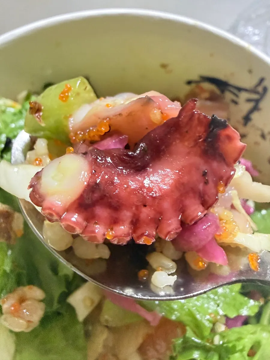Close-up of tender octopus on the poke bowl