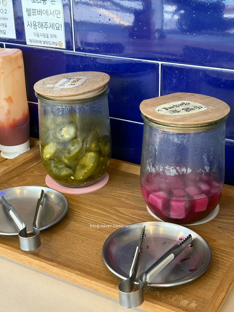 Jalapeños and pickles at the self-bar