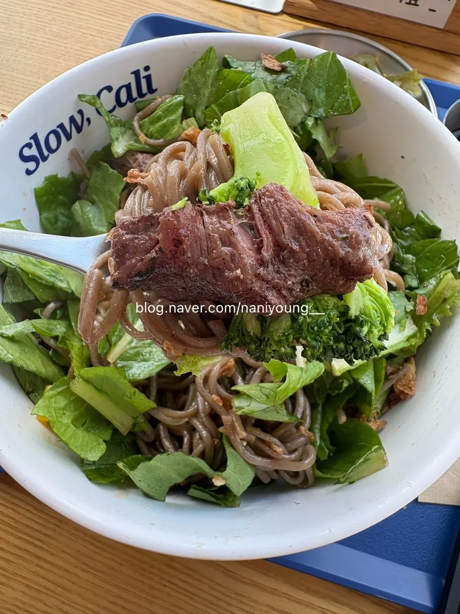 Beef flap steak bowl topped with jalapeños