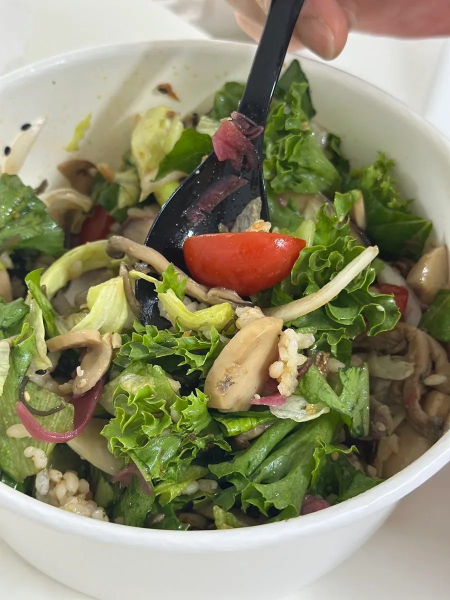 Scooping up a bite of truffle mushroom poke