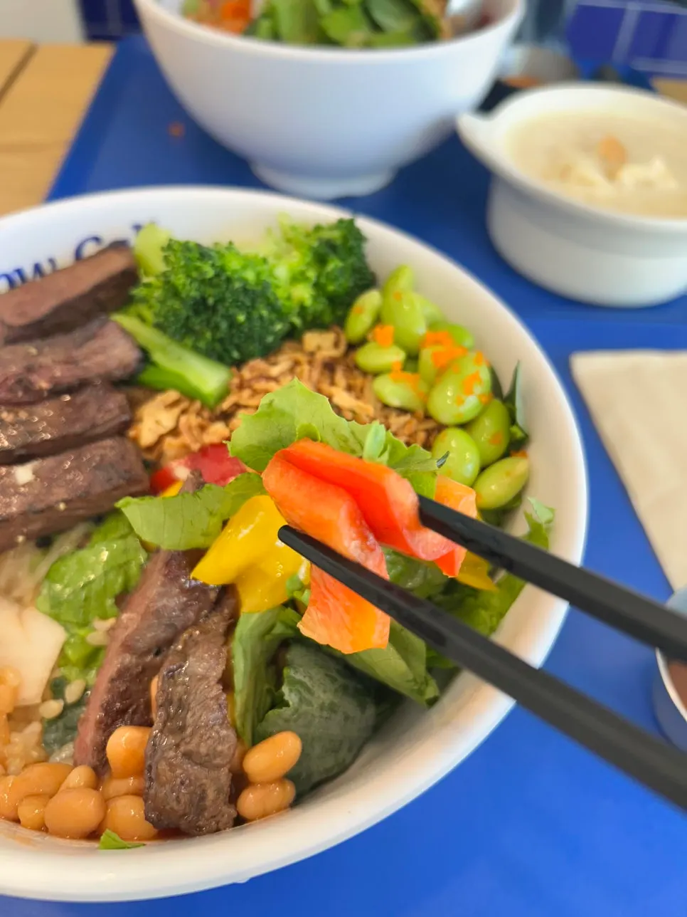 Cross-section of the beef bowl showing the brown rice layer