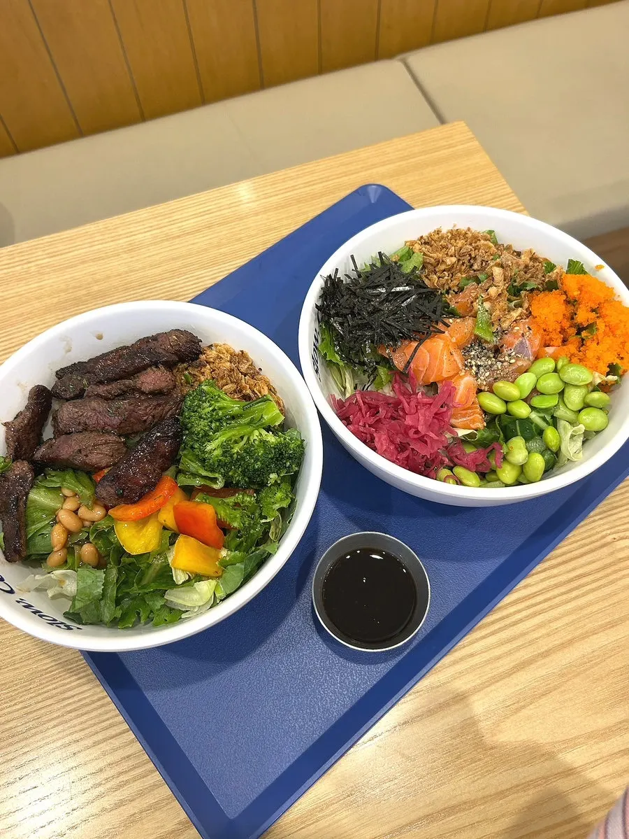 Two bowls: salmon poke and flank steak steak bowl