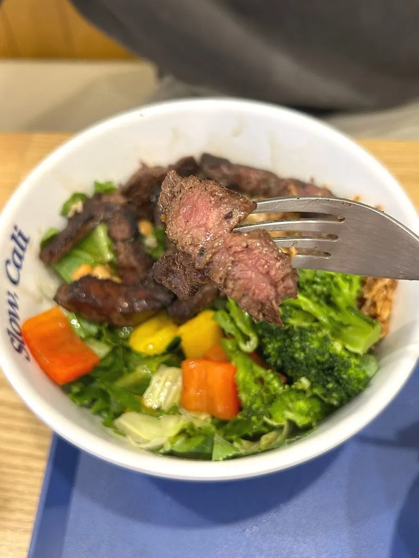 Flank steak bowl drizzled with soy sauce