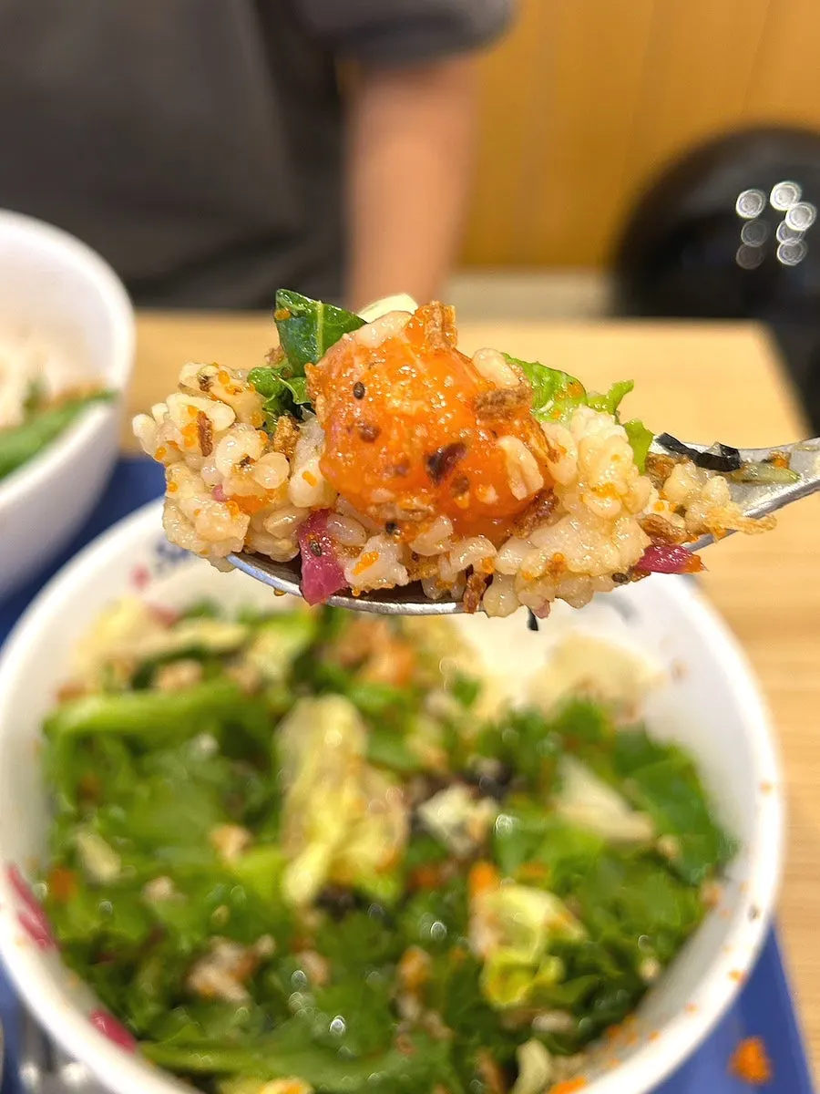Close-up of salmon poke mixed with classic sauce