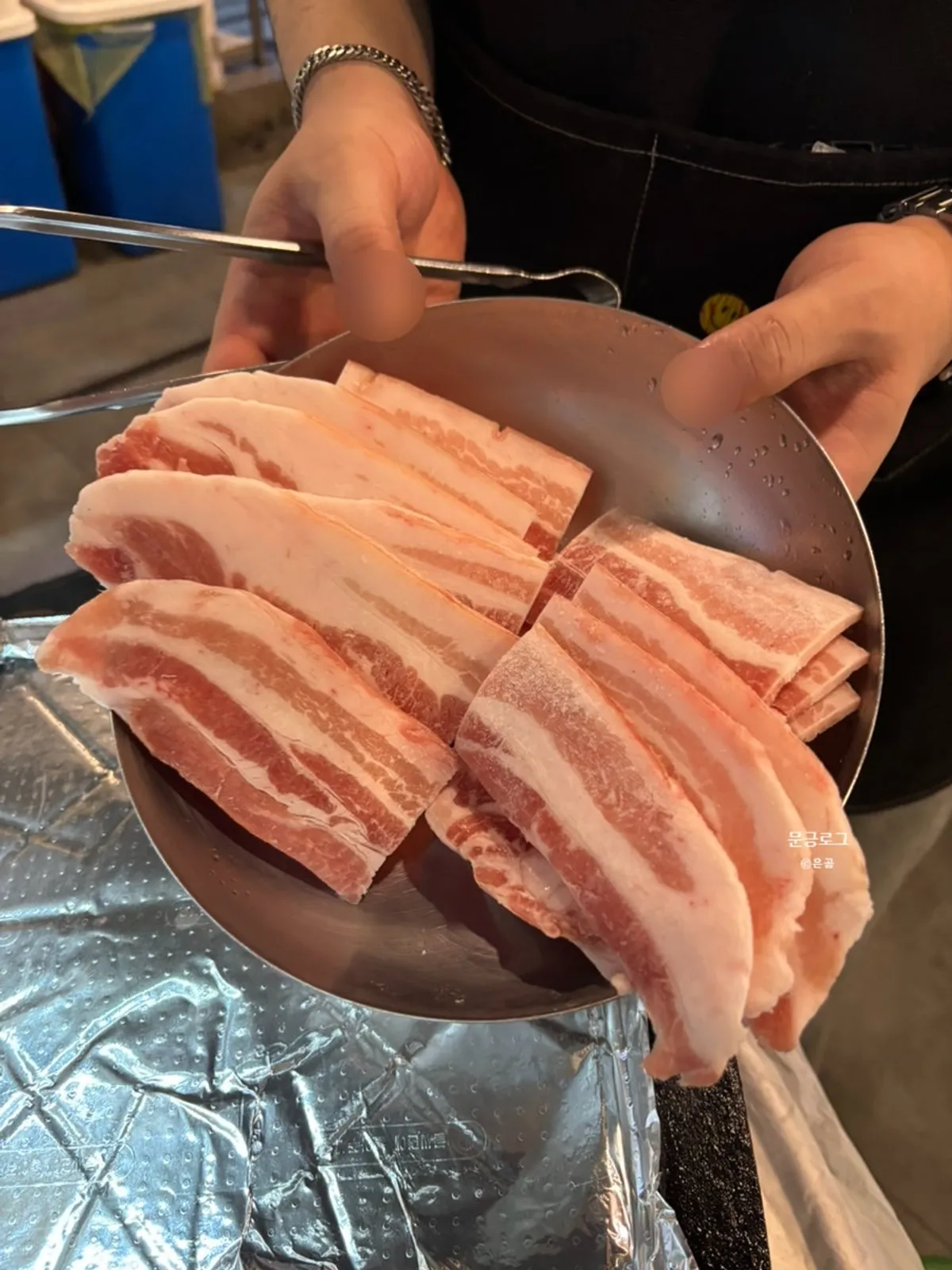 Frozen samgyeopsal and ogyeopsal on the grill