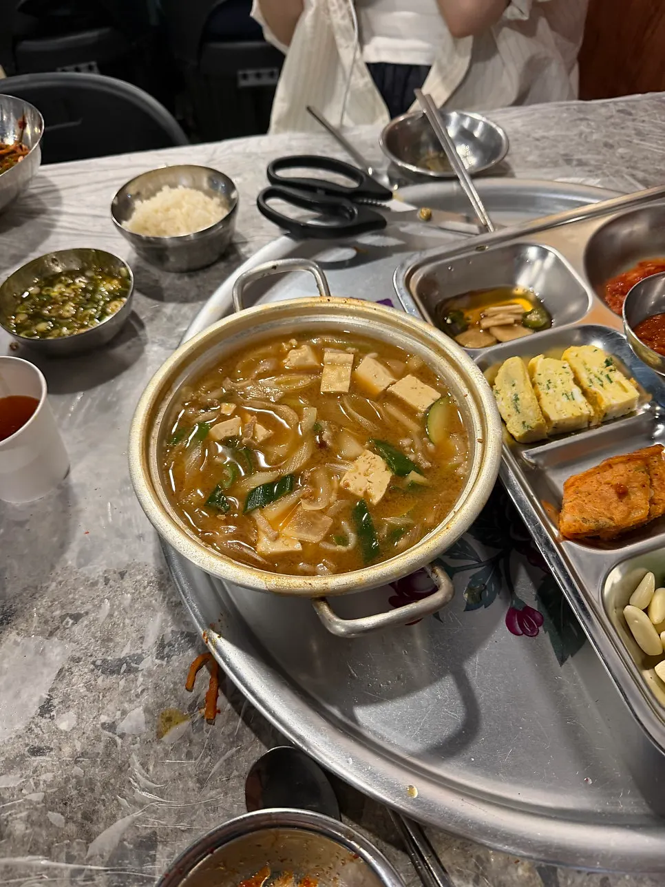 A generous bowl of doenjang stew with a bowl of rice