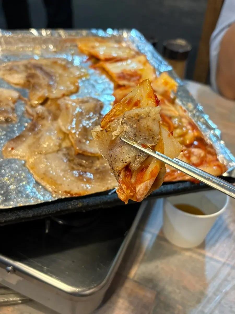 Grilled frozen samgyeopsal served with pajeori