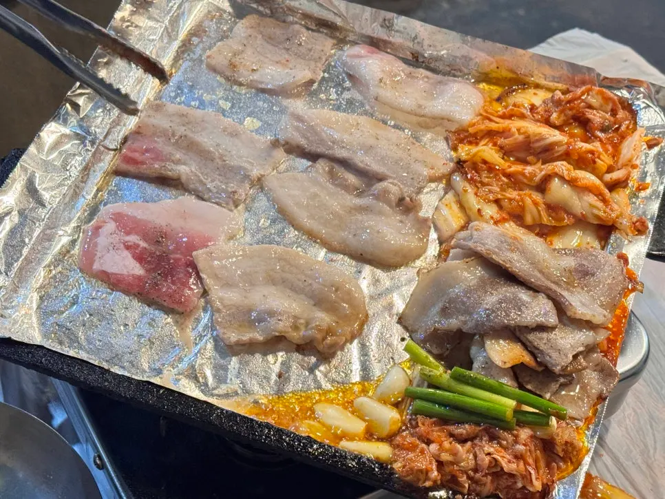 Kimchi grilling alongside the meat on the pan