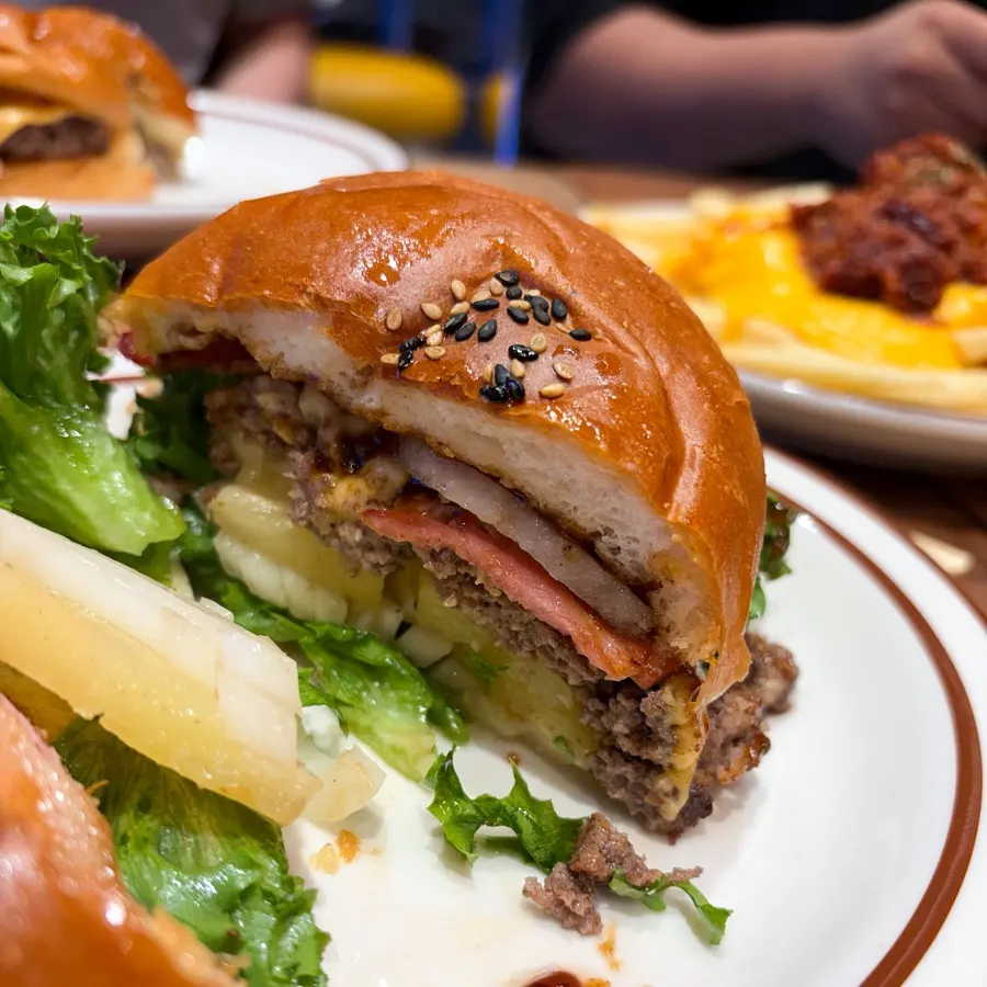 Cross-section of the Hawaiian BBQ burger with pineapple and bacon