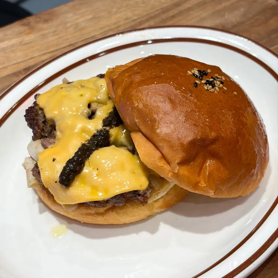 A bite taken out of the Hawaiian BBQ burger