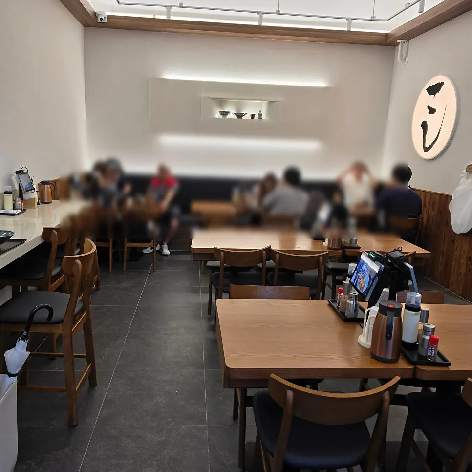 Interior with window counter seats and tables
