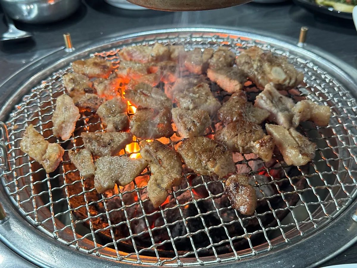 Marinated pork galbi grilling over charcoal