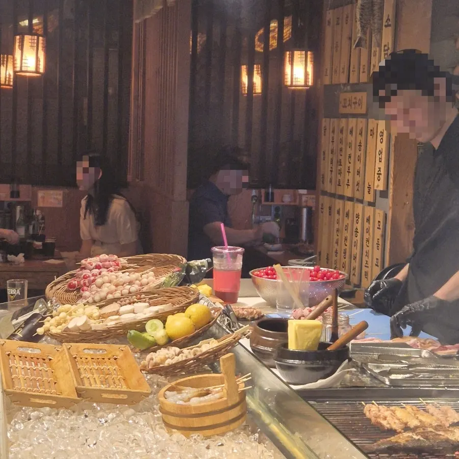 Grilling ingredients displayed around the robatayaki grill