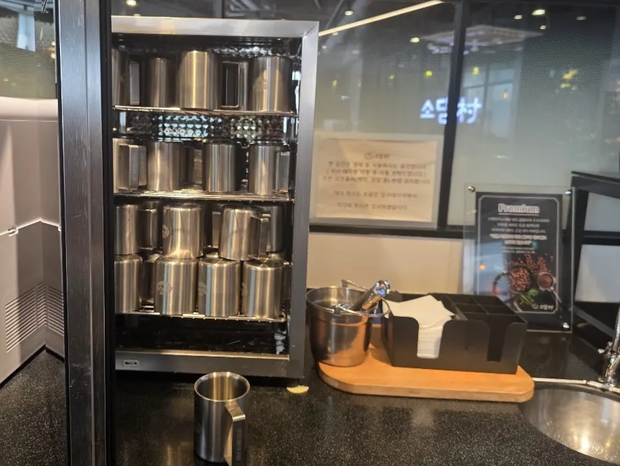 Iced coffee served in a stainless steel cup