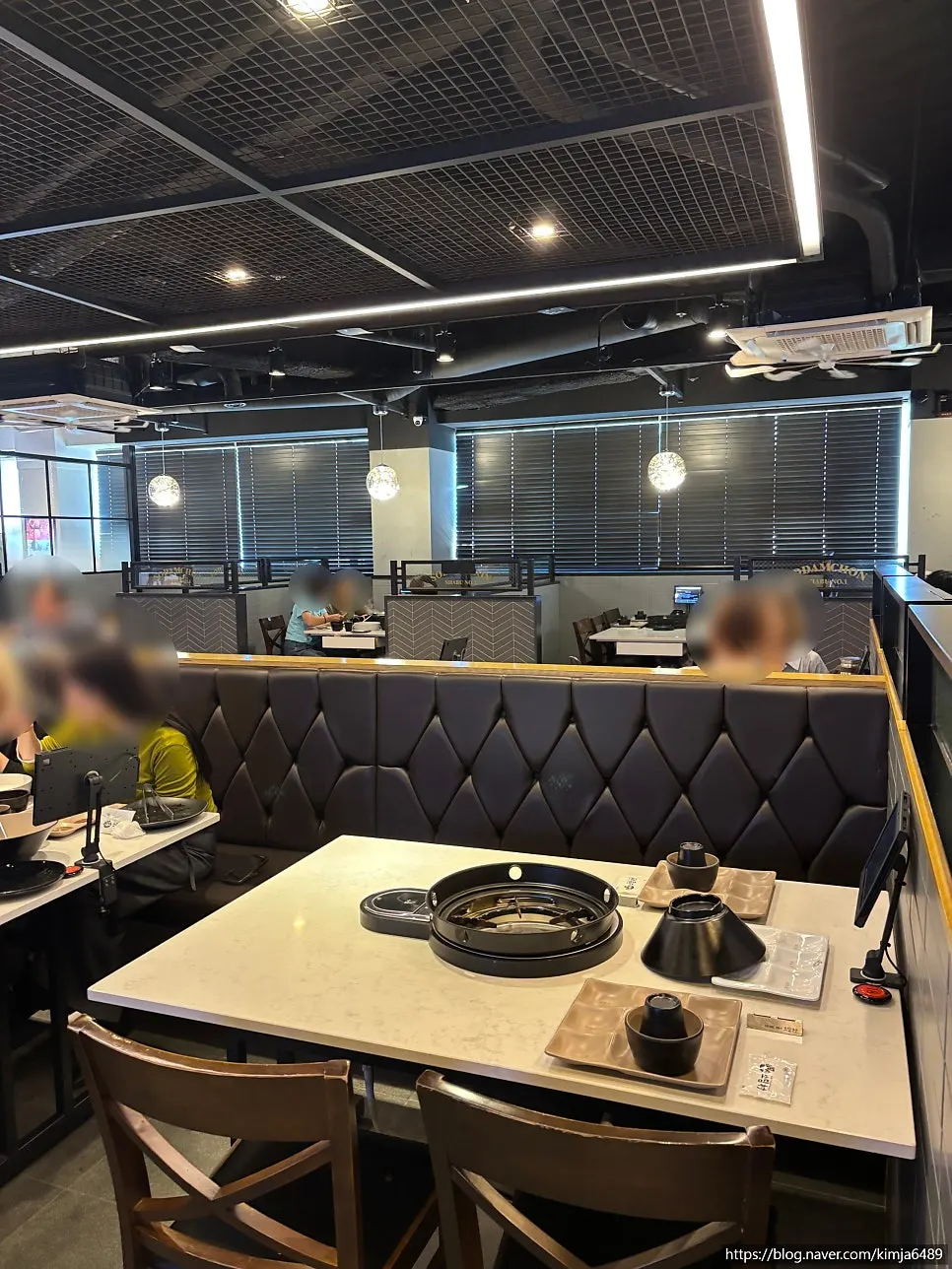 Sofa seats and large group tables in the dining room
