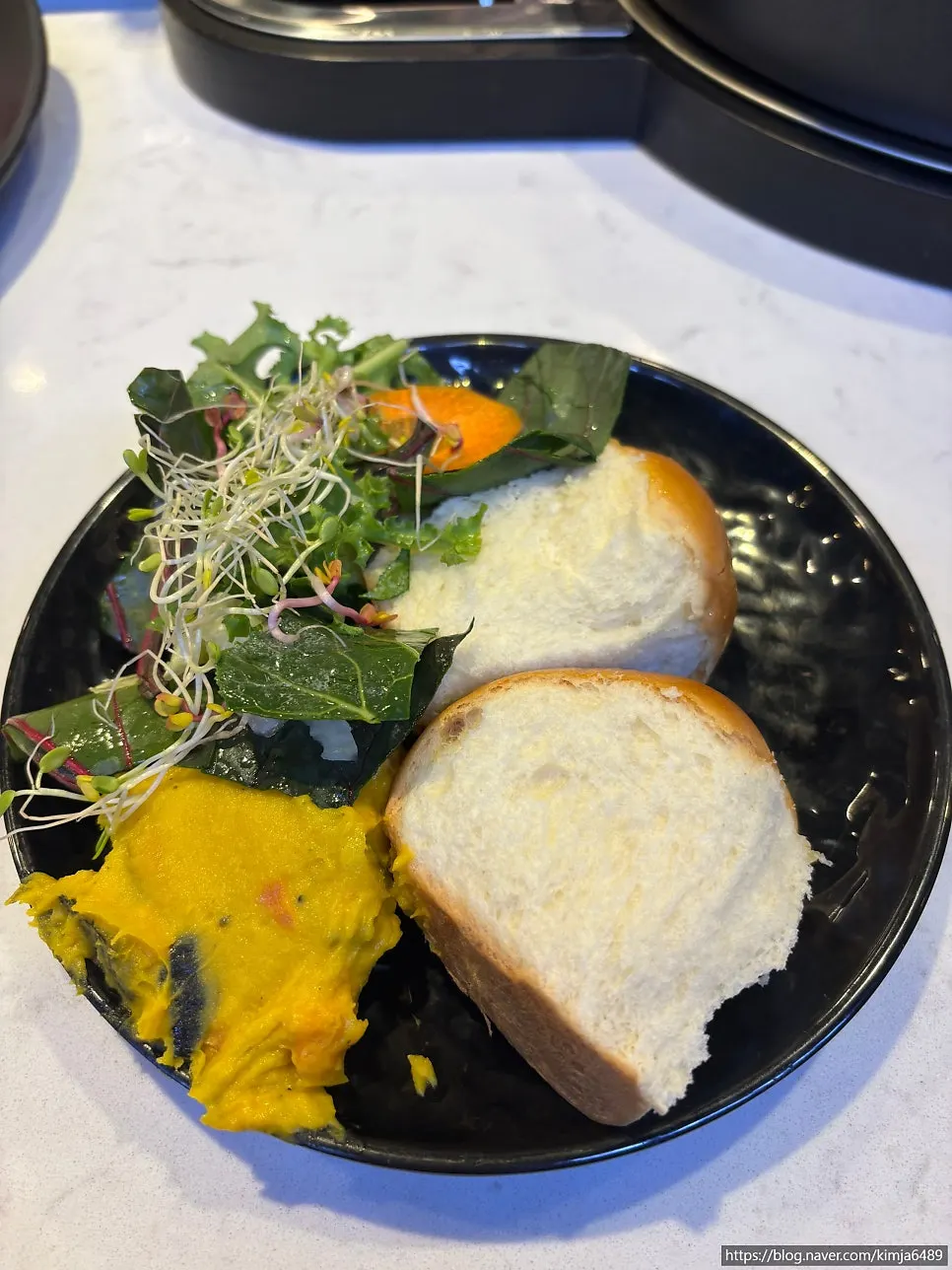 Plate of shabu-shabu vegetables gathered from the self-refill bar
