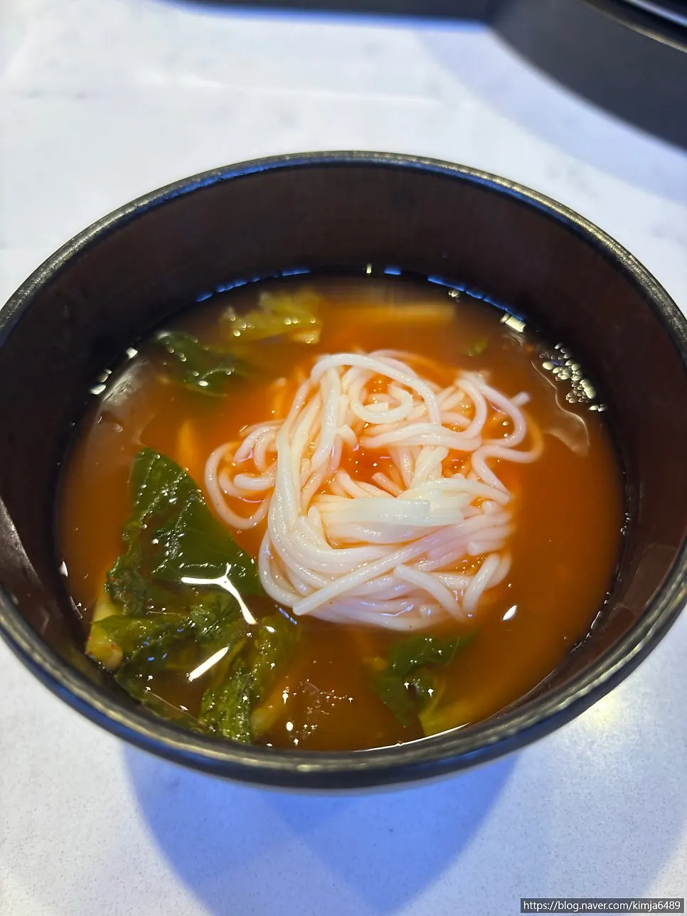 Broth tteokbokki, dinner rolls, and pumpkin salad