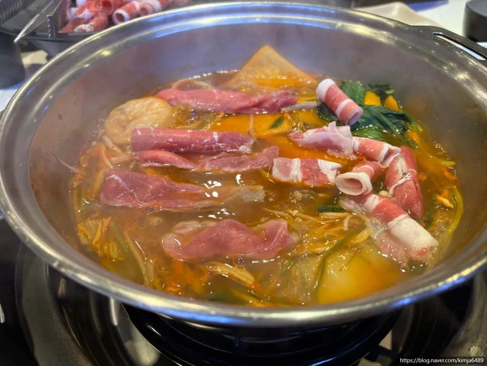 Shabu-shabu pot bubbling with ingredients